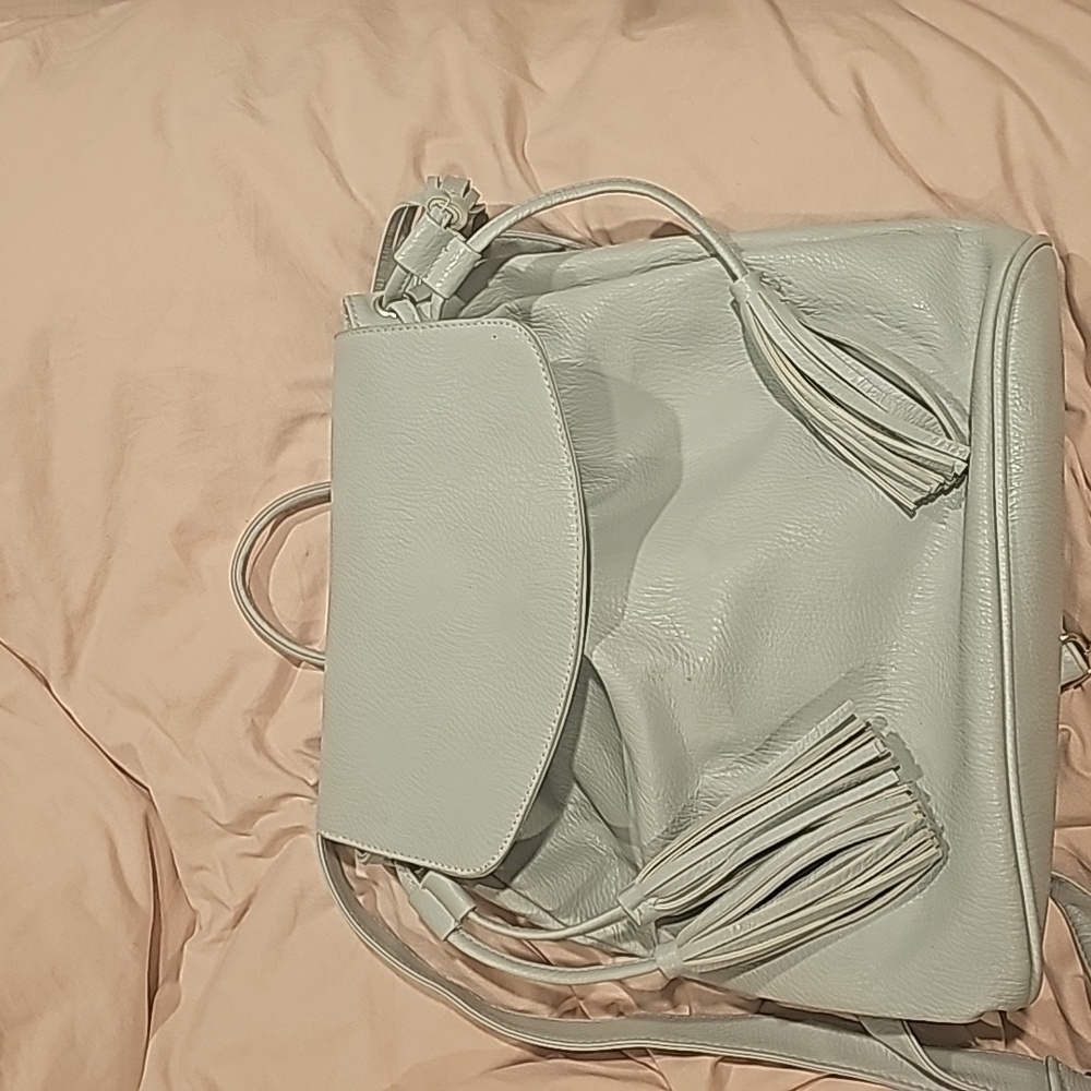 Gray backpack Gray backpack with tassels.